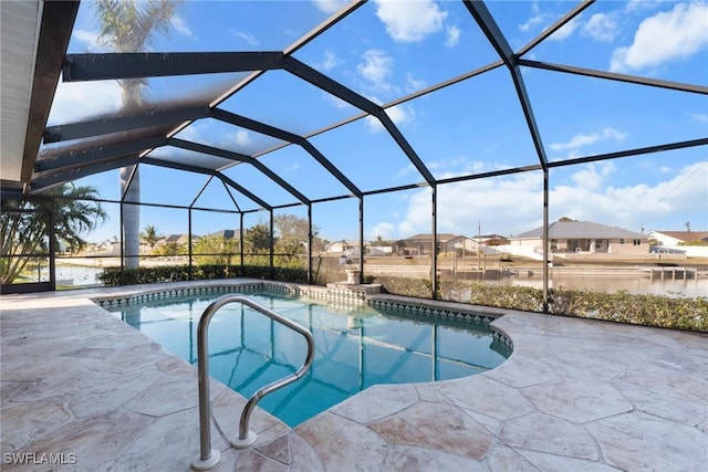 view of swimming pool featuring glass enclosure and a patio area