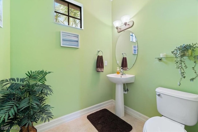 bathroom featuring tile patterned flooring and toilet