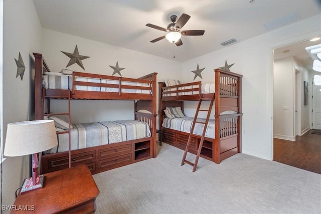 carpeted bedroom featuring ceiling fan