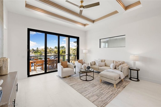 living room with ceiling fan and coffered ceiling