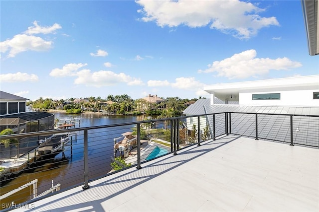 balcony featuring a water view