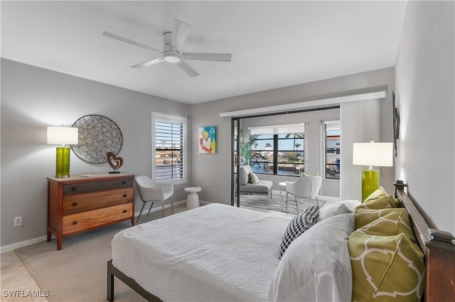 bedroom featuring carpet flooring, a ceiling fan, and baseboards