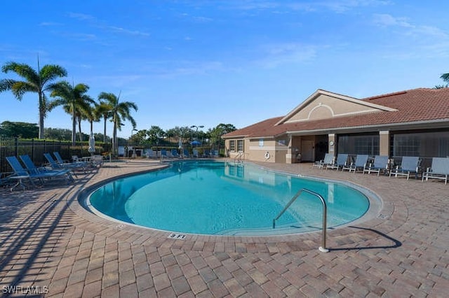 view of swimming pool featuring a patio area