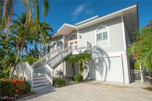 view of front of property with covered porch and a garage