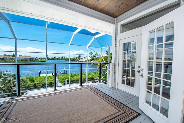 exterior space featuring a water view and french doors