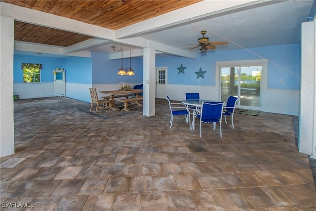 interior space with ceiling fan