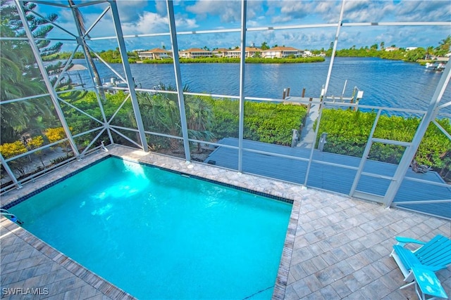 view of swimming pool with a water view, a lanai, and a patio area