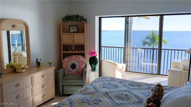 tiled bedroom with a water view and multiple windows