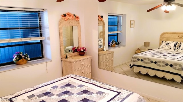 bedroom with light tile patterned floors and ceiling fan