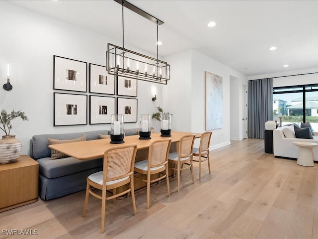 dining area with light hardwood / wood-style floors