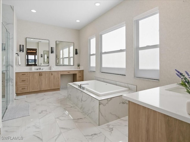 bathroom featuring separate shower and tub and vanity