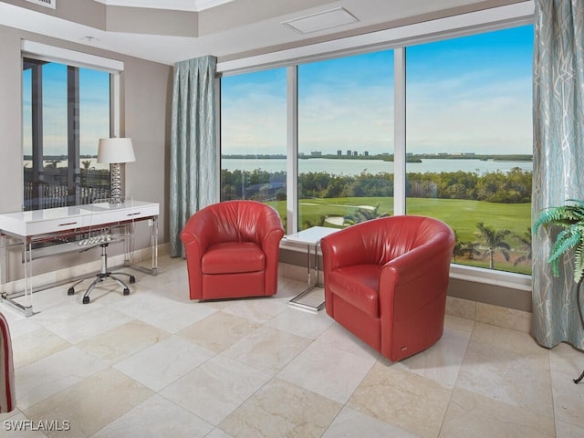 sitting room featuring a water view