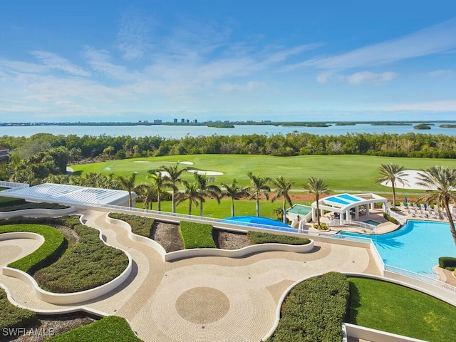 view of swimming pool with a water view