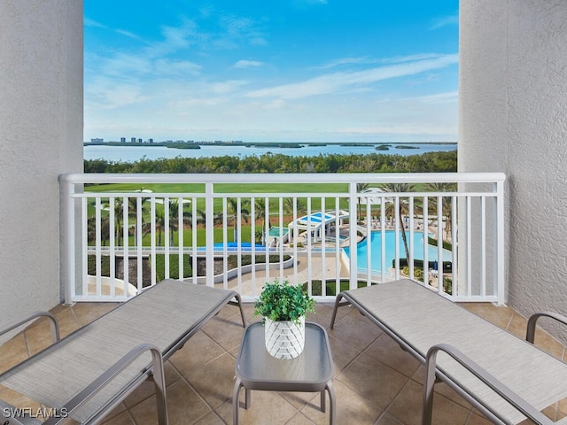 balcony featuring a water view