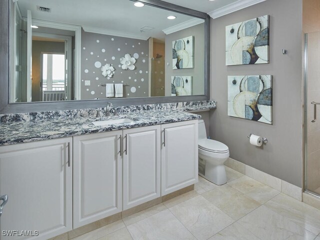 bathroom featuring vanity, toilet, an enclosed shower, and ornamental molding