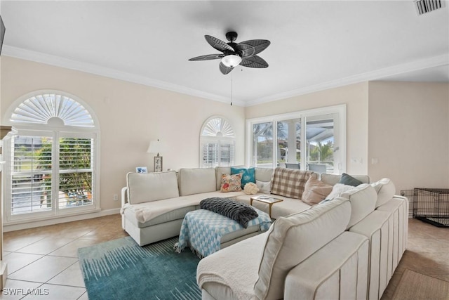 tiled living room with ceiling fan and ornamental molding