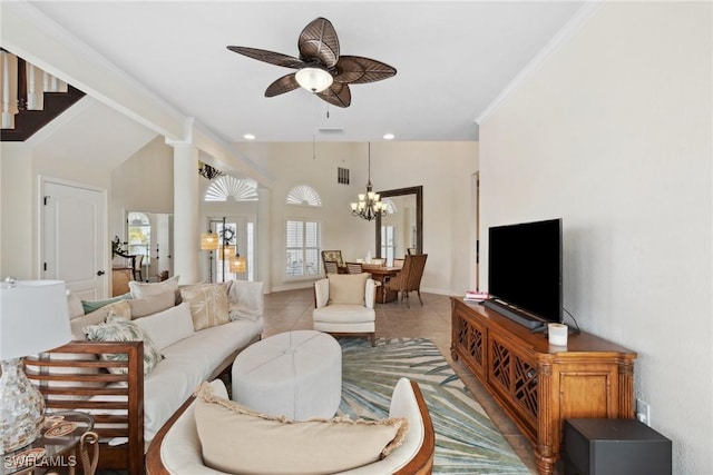 tiled living room featuring ceiling fan with notable chandelier, vaulted ceiling, and crown molding