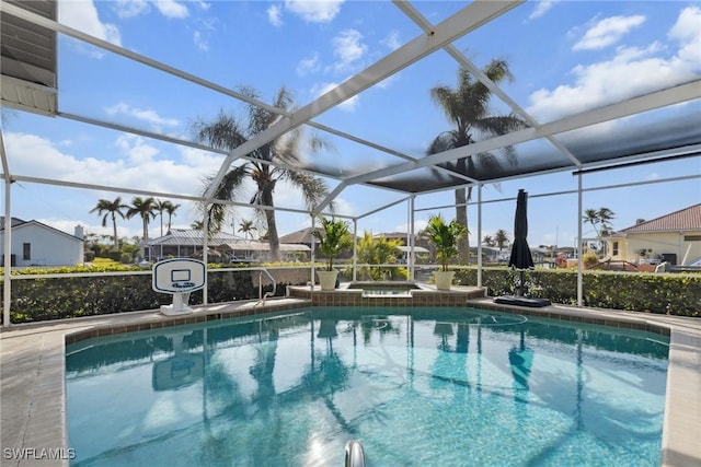 view of pool with a lanai