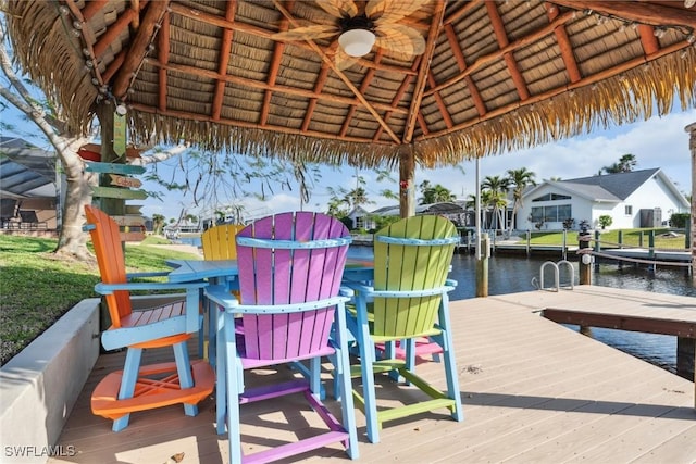 view of dock featuring a gazebo and a water view