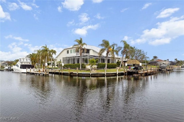 water view with a dock and a residential view