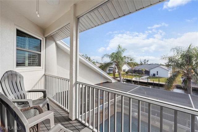 balcony with a water view and a residential view