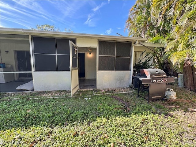 exterior space with a lawn and fence