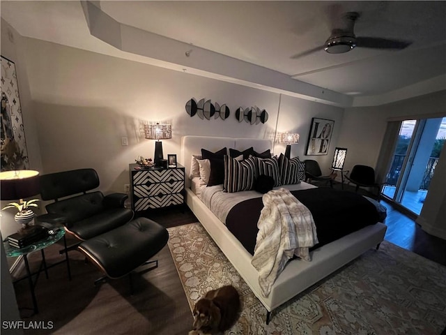 bedroom featuring ceiling fan and a tray ceiling