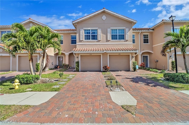 mediterranean / spanish-style house featuring a garage