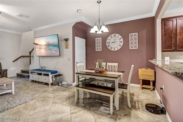 dining space with crown molding and an inviting chandelier