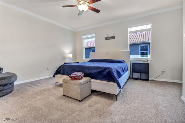 bedroom with carpet flooring, ceiling fan, and ornamental molding