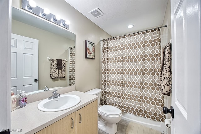 full bathroom featuring vanity, shower / bath combo, tile patterned flooring, toilet, and a textured ceiling