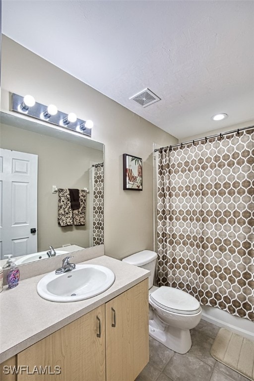 full bathroom with tile patterned flooring, vanity, toilet, and shower / tub combo with curtain