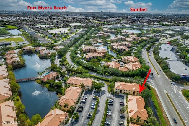 birds eye view of property with a water view