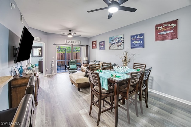 dining area featuring hardwood / wood-style floors and ceiling fan