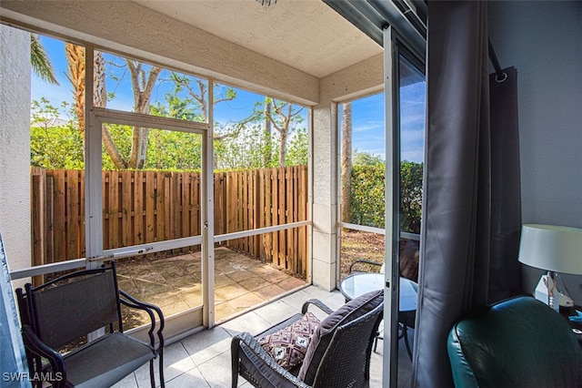 sunroom / solarium featuring plenty of natural light