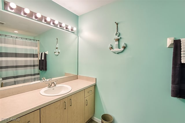 bathroom with a shower with curtain and vanity