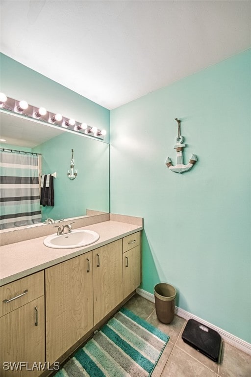 bathroom with tile patterned floors and vanity