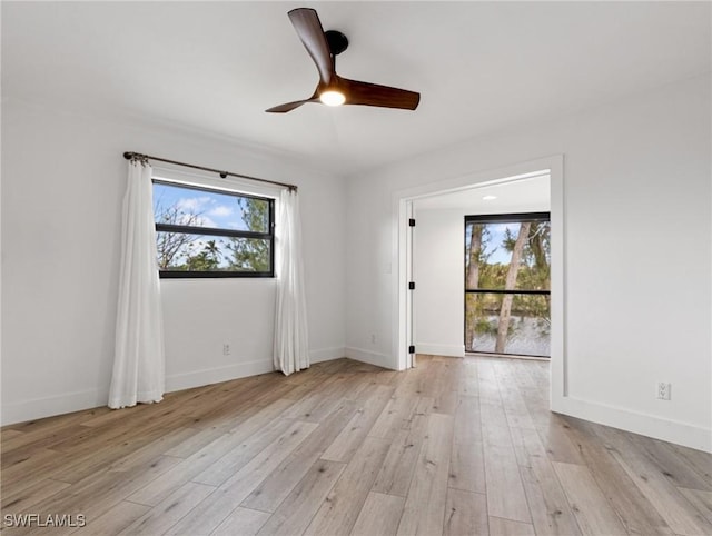 unfurnished room featuring ceiling fan and light hardwood / wood-style flooring