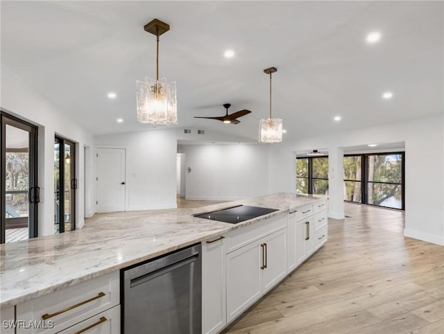 kitchen with light stone counters, stainless steel dishwasher, pendant lighting, ceiling fan, and white cabinets