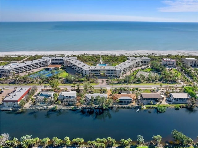 aerial view featuring a water view and a beach view