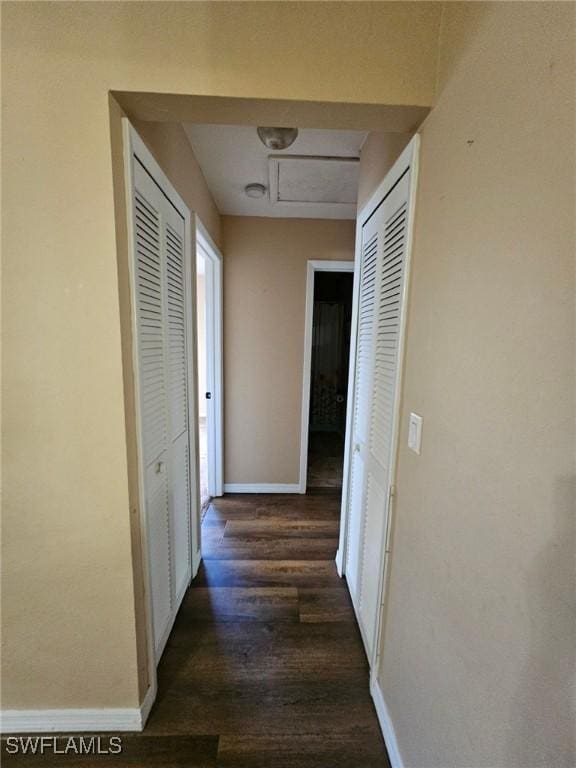 hall with dark hardwood / wood-style flooring