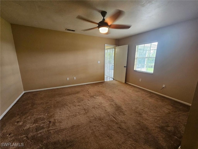 unfurnished room with carpet and ceiling fan