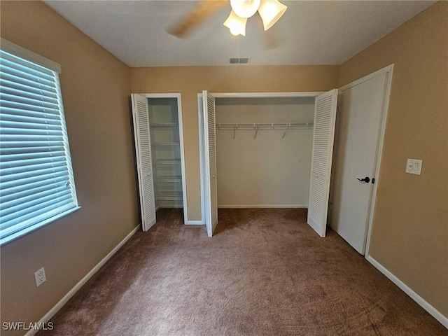 unfurnished bedroom featuring carpet flooring and ceiling fan