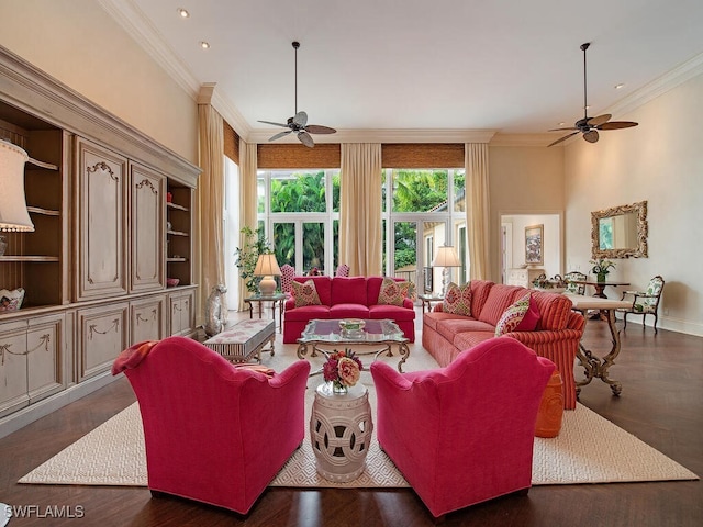 living room featuring ceiling fan, ornamental molding, and plenty of natural light