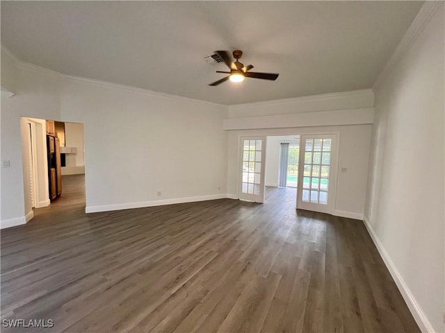 spare room featuring french doors, dark hardwood / wood-style floors, ceiling fan, and crown molding