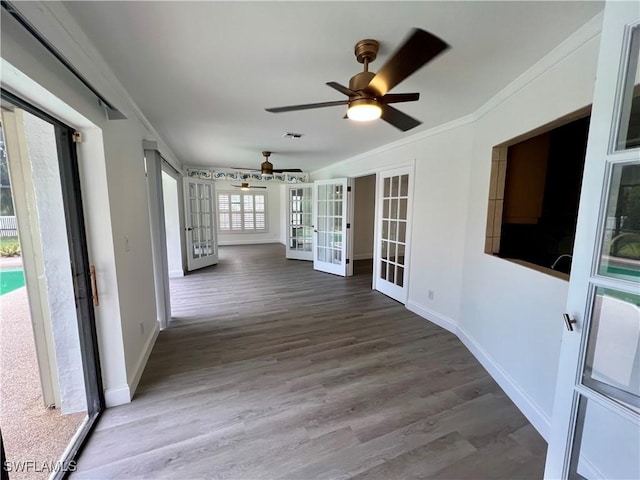 interior space featuring ceiling fan and french doors