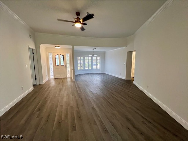 unfurnished living room with ceiling fan with notable chandelier, dark hardwood / wood-style flooring, and crown molding