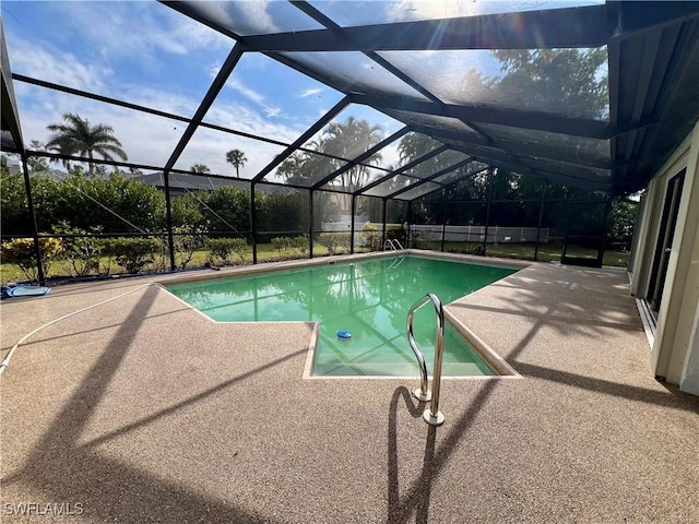 view of pool featuring a lanai and a patio area