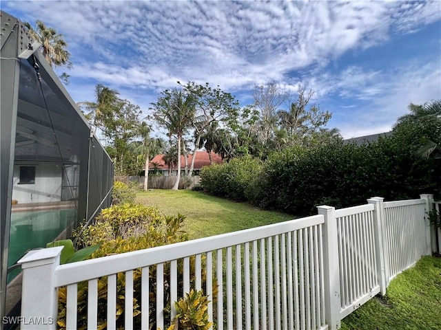 view of yard with a lanai