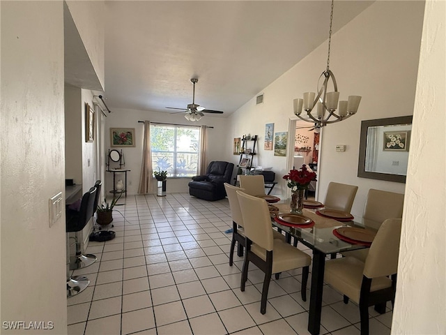 dining space with light tile patterned floors and ceiling fan with notable chandelier